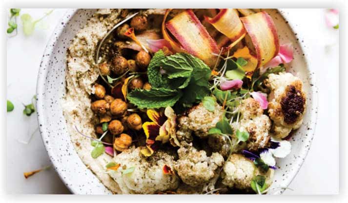 Spicy Roasted Cauliflower Over Hummus